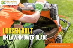 how to loosen bolt on lawn mower blade